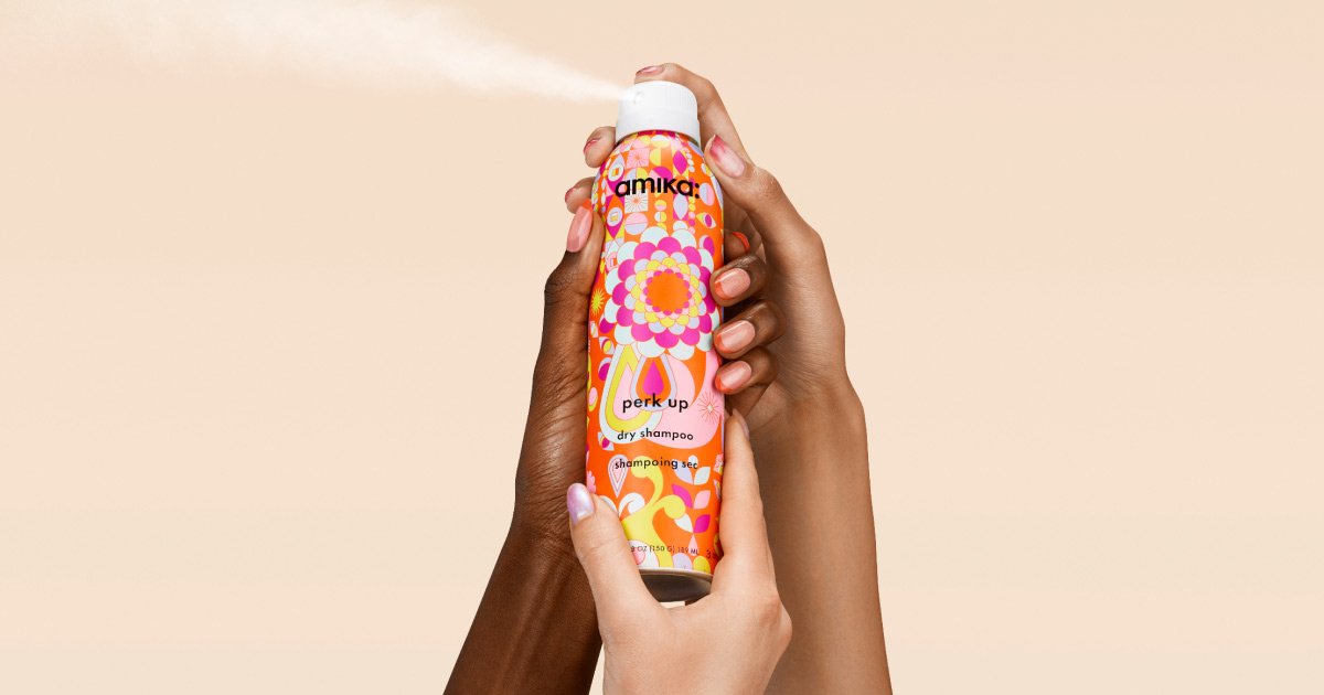 amika Perk Up Dry Shampoo being sprayed