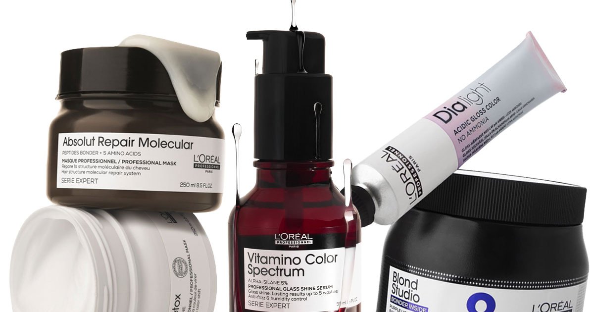 Assorted L'Oréal Professionnel hair care products, including Absolut Repair Molecular mask, Vitamino Color Spectrum serum, Dialight gloss color tube, and Blond Studio jar.