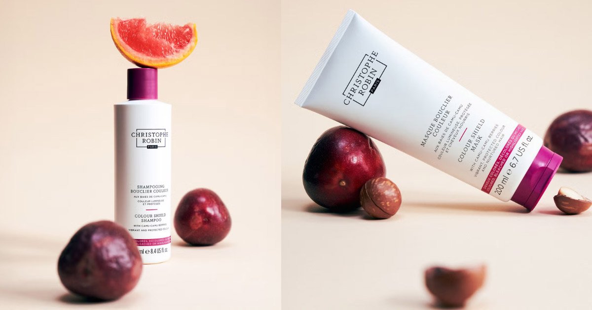 Two-panel image featuring Christophe Robin Colour Shield shampoo and hair mask bottles displayed alongside blood orange slices, camu camu berries, and nuts. (put image under the shampoo & conditioner systems)